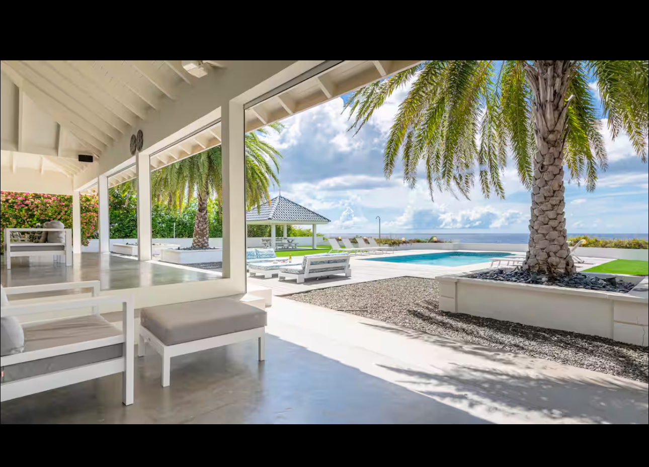 Covered lounge opening directly to the pool and ocean